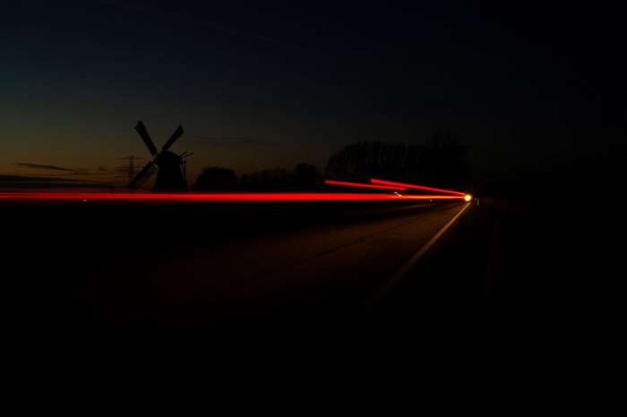 Long exposure of car lights at night with a windmill