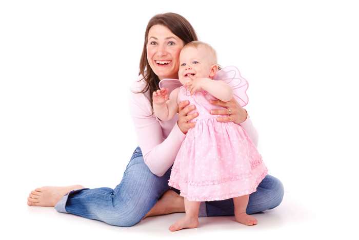 Mother and baby girl in pink dress