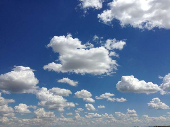Blue sky with white cumulus clouds