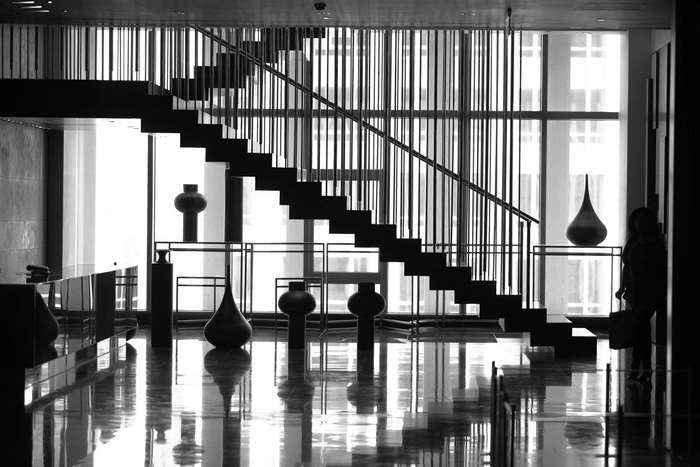 Modern interior with staircase and decorative vases