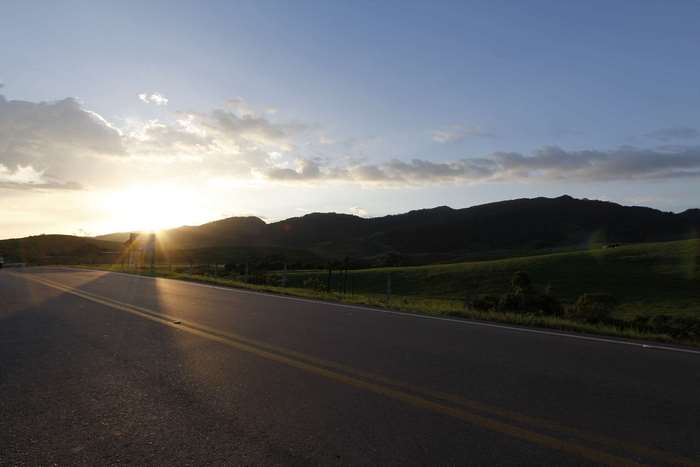 Road in Colombia at sunset with mountains and sky 4K
