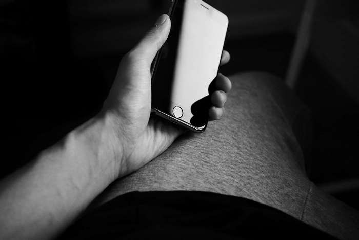 Hand holding an iPhone 6