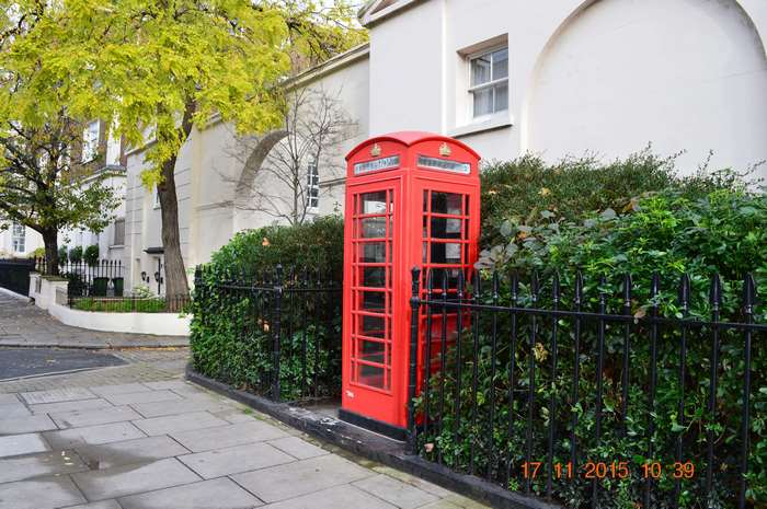Red phone booth in London 4K