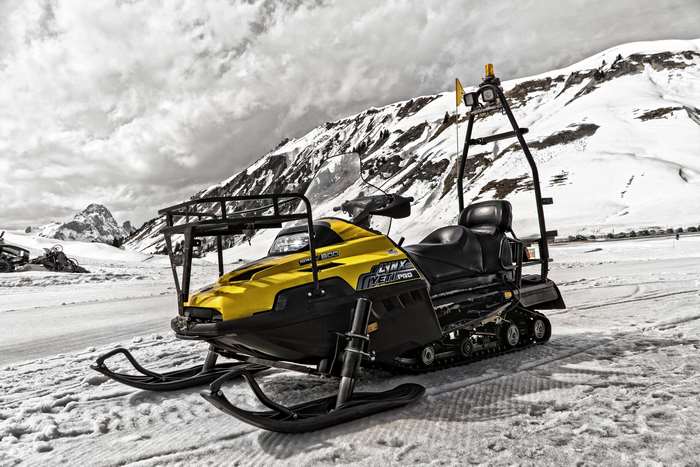 Yellow Lynx Snowmobile in Snowy Mountains 4K