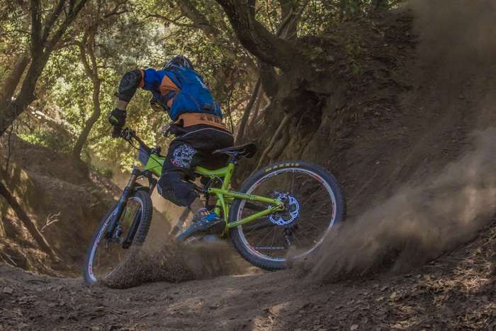 Mountain biker riding on a dirt trail