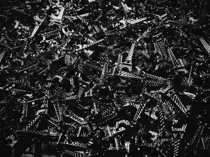 Pile of miniature Eiffel Tower replicas