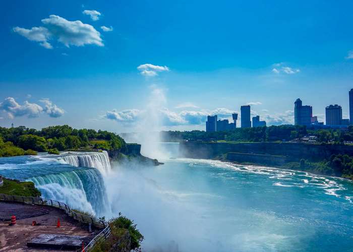 Niagara Falls with city skyline and blue sky
