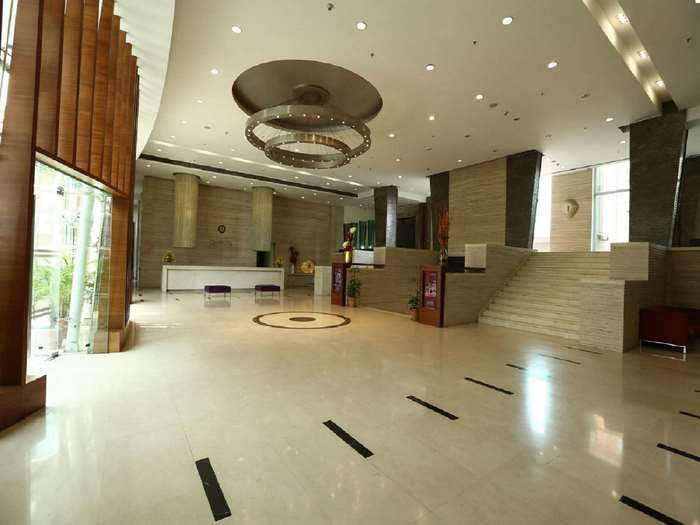 Hotel lobby with reception and staircase