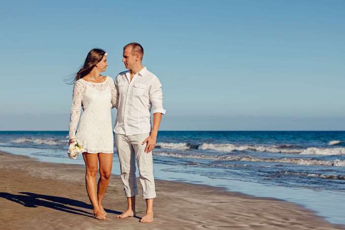 Couple on a beach during a wedding photoshoot