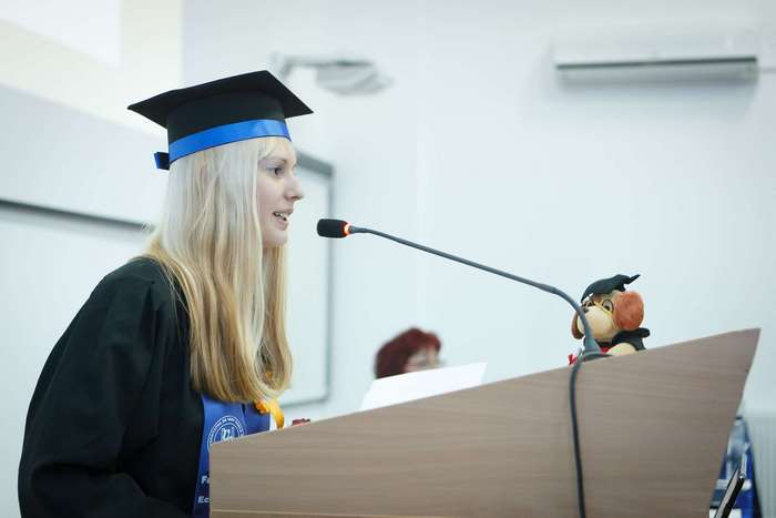 Graduate giving a speech at a graduation ceremony