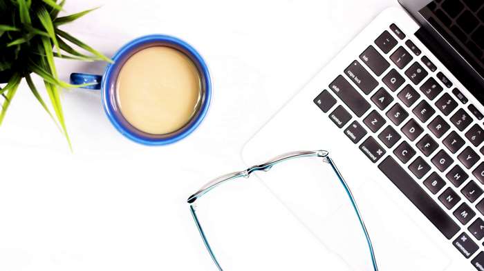 Coffee, Laptop, Glasses, and Plant Flat Lay