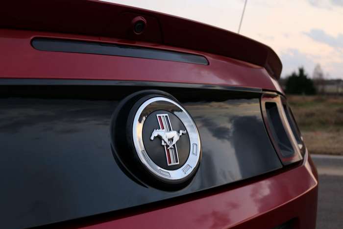 Ford Mustang Emblem on Red Car