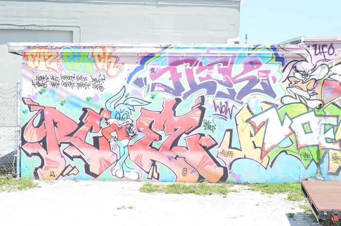 Graffiti art with cartoon characters on a wall 4K