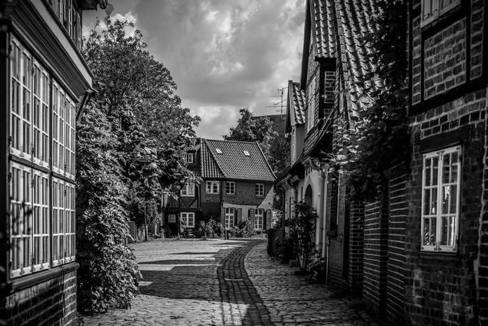 Cobblestone street in an old European town with historic buildings