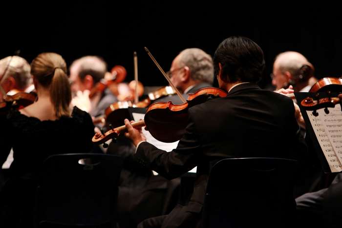 Orchestra performing with violins 4K