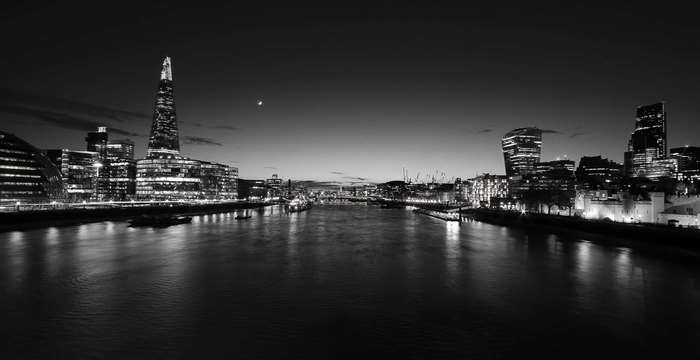 London skyline at night with The Shard and River Thames