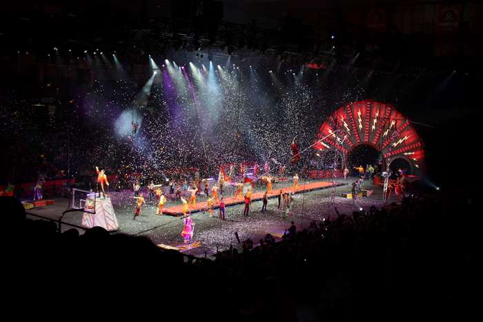 Circus performance with confetti and performers