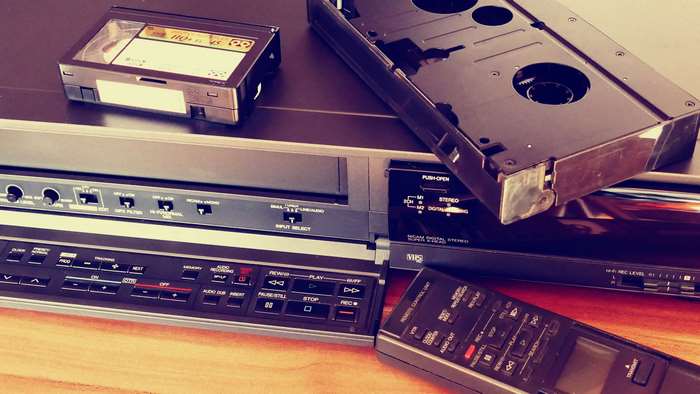 Vintage VCR, VHS tape, and remote control