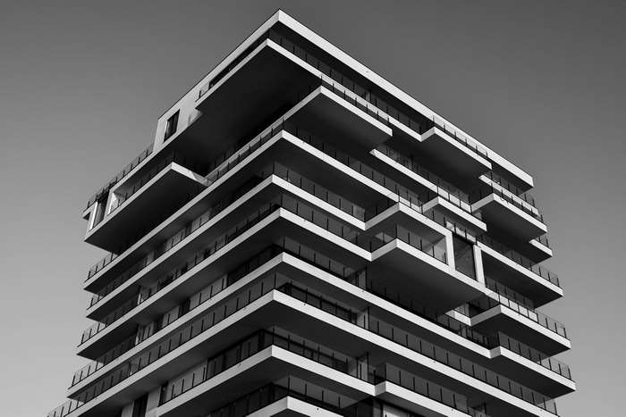 Modern apartment building with balconies and glass windows