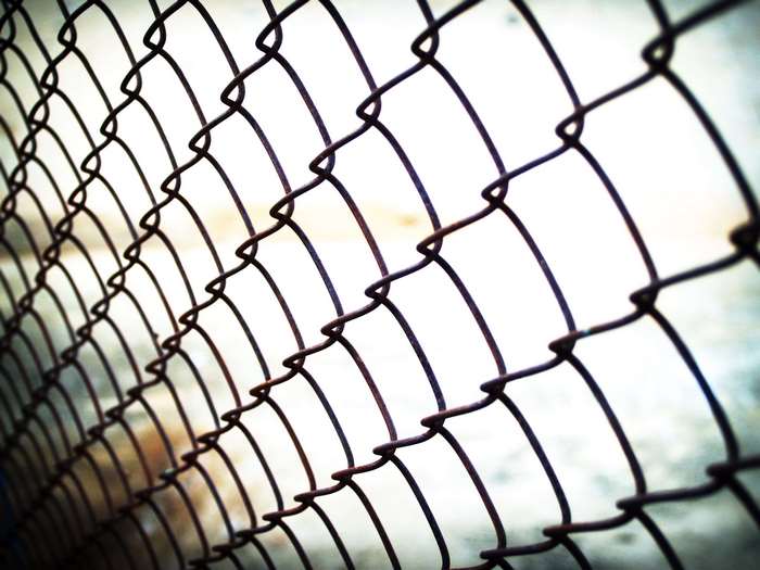 Close-up of a rusty chain-link fence
