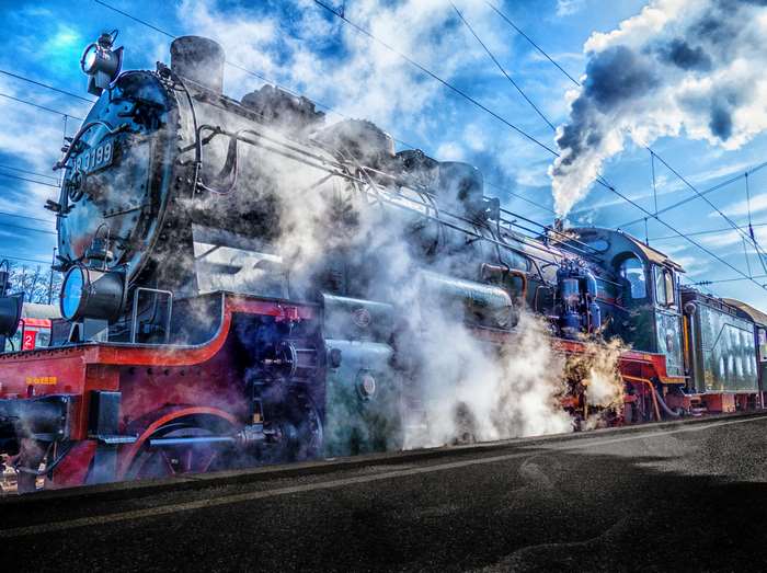 Steam locomotive 0199 with steam and smoke