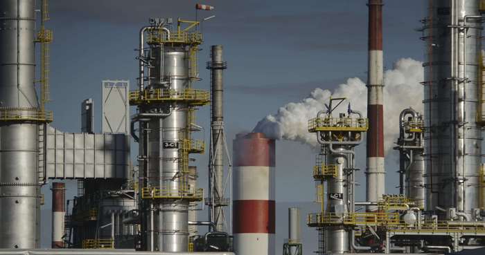 Oil refinery with smoke stacks and industrial equipment 4K