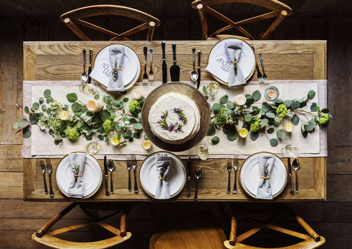 Wedding Table Setting with Cake and Floral Decorations