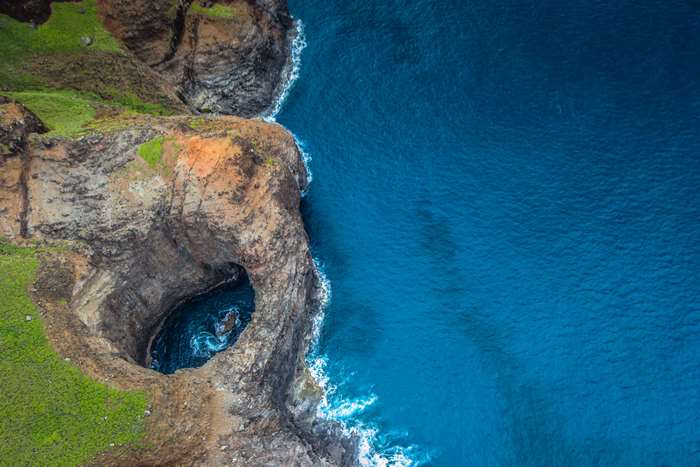 Cliff coast with ocean cave, Kauai 4K