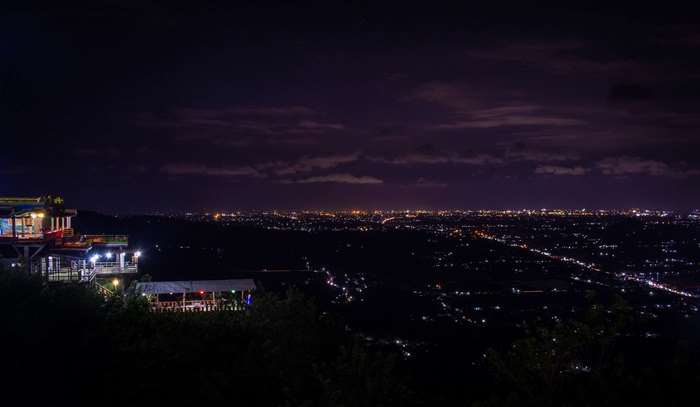 Cityscape at night with illuminated buildings