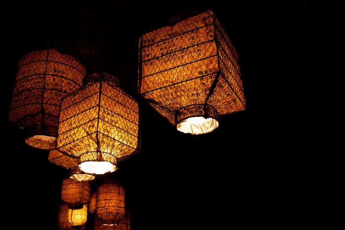 Illuminated Chinese paper lanterns with golden light