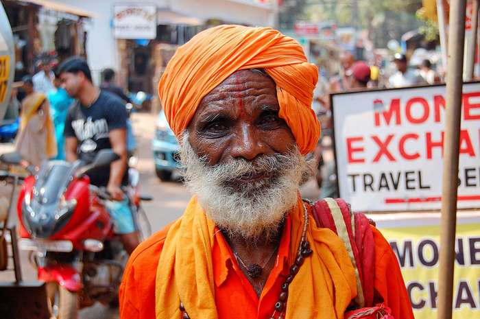 Elderly Indian man with orange turban and beard