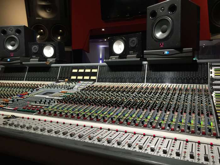 Mixing console and studio monitors in a recording studio
