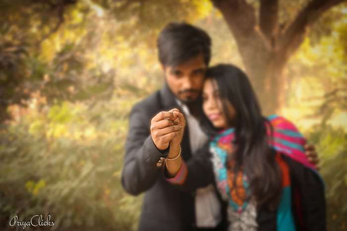 Couple holding hands during pre-wedding photoshoot