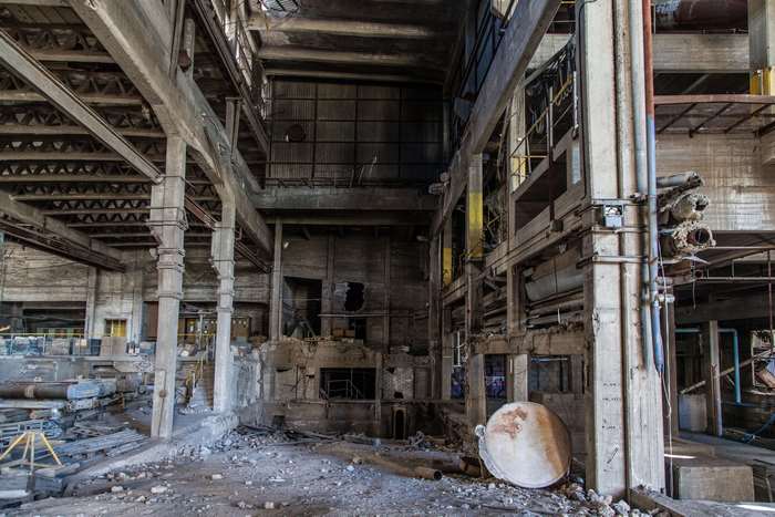 Abandoned industrial building interior with debris