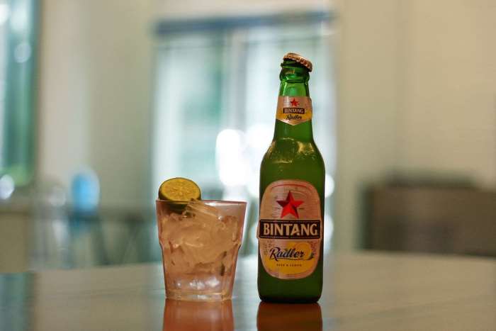 Bintang Radler beer bottle and glass with lime