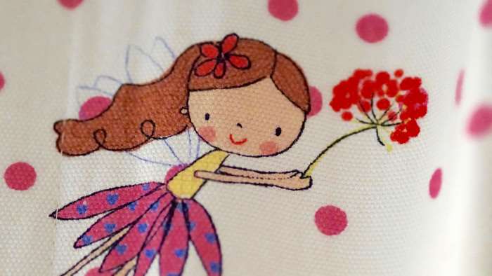Cute fairy with flower and polka dots