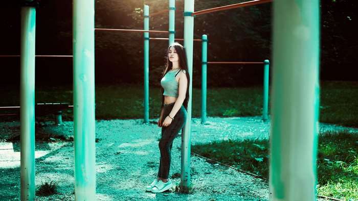 Athletic girl in active wear at outdoor gym
