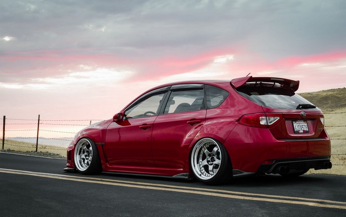 Red Subaru Impreza WRX STI hatchback tuned