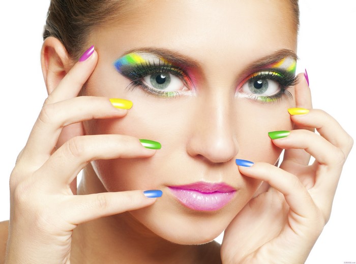 Woman with colorful makeup and nails
