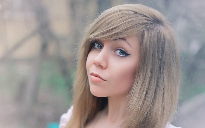 Young woman with blonde hair and blue eyes