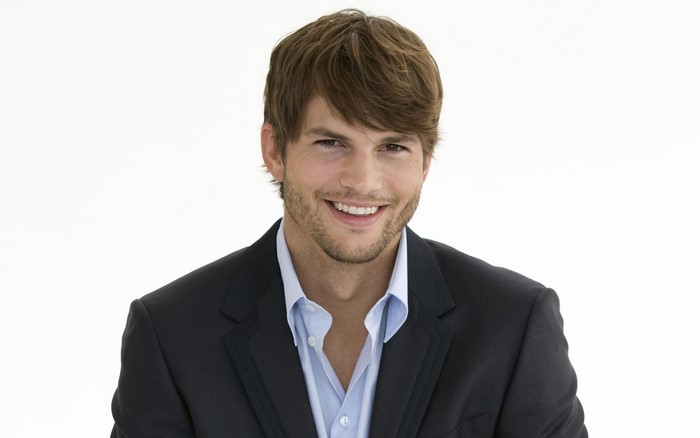 Ashton Kutcher wearing a suit and shirt