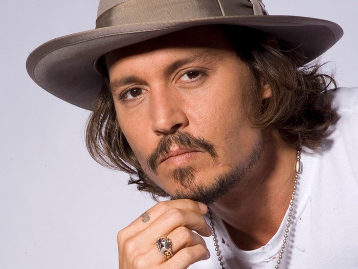 Johnny Depp wearing a hat and ring