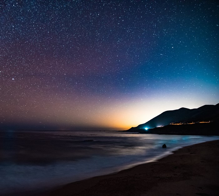Starry Night Sky Over Mountain Shore