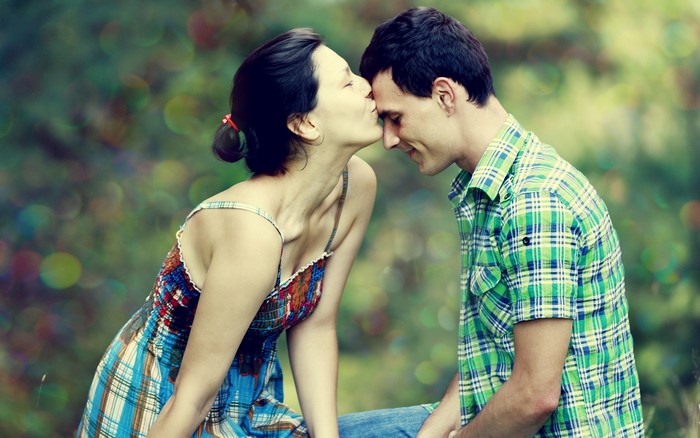 Couple sharing a tender moment outdoors