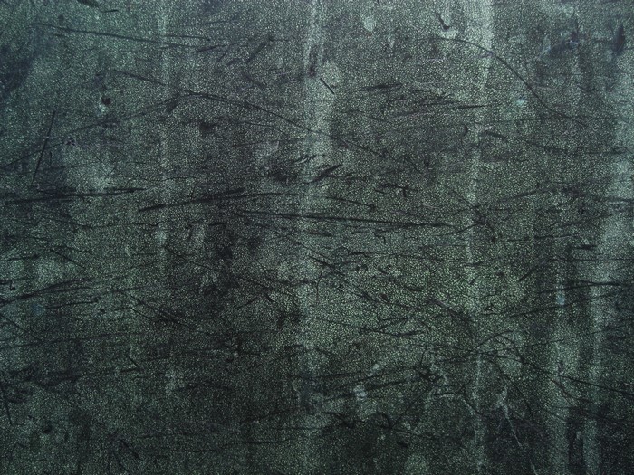 Dark textured surface with scratches
