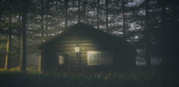 Log cabin in a dark forest with a lamp