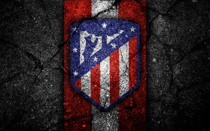 Atlético Madrid soccer logo on cracked background