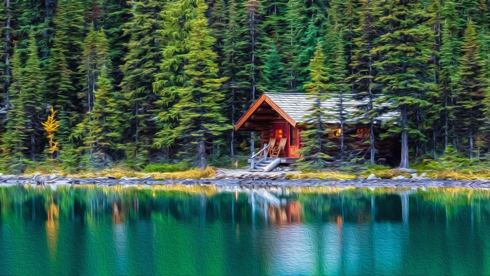 Cabin by a lake in a forest