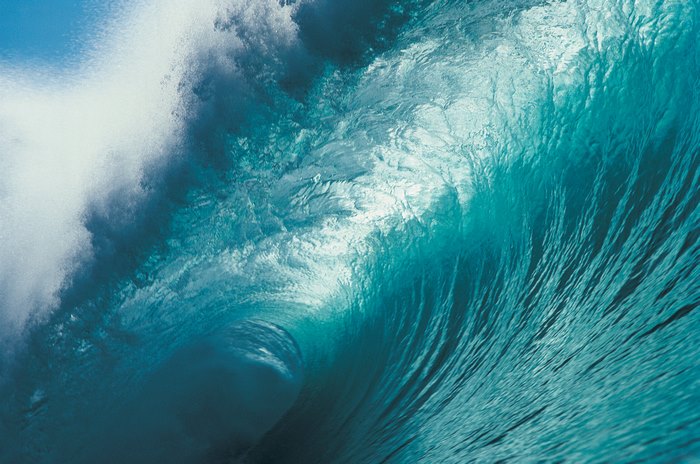 Close-up of a powerful blue ocean wave