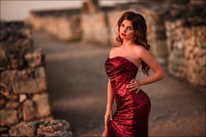 Woman in a red sequined dress